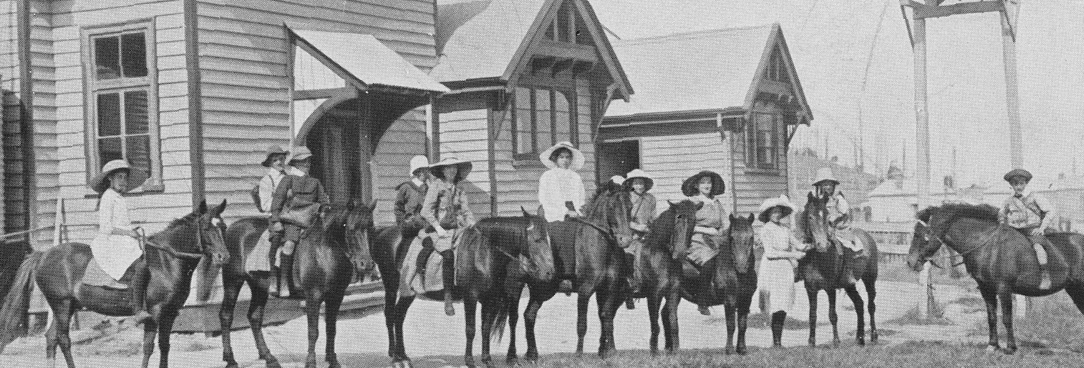 Black and white photo, school children on horses